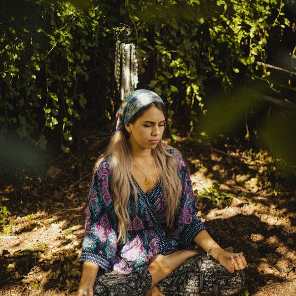 Person in a state of deep focus and concentration outdoors.